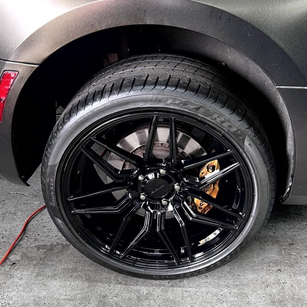 Alloy wheel refinished after kerb damage from tight street parking