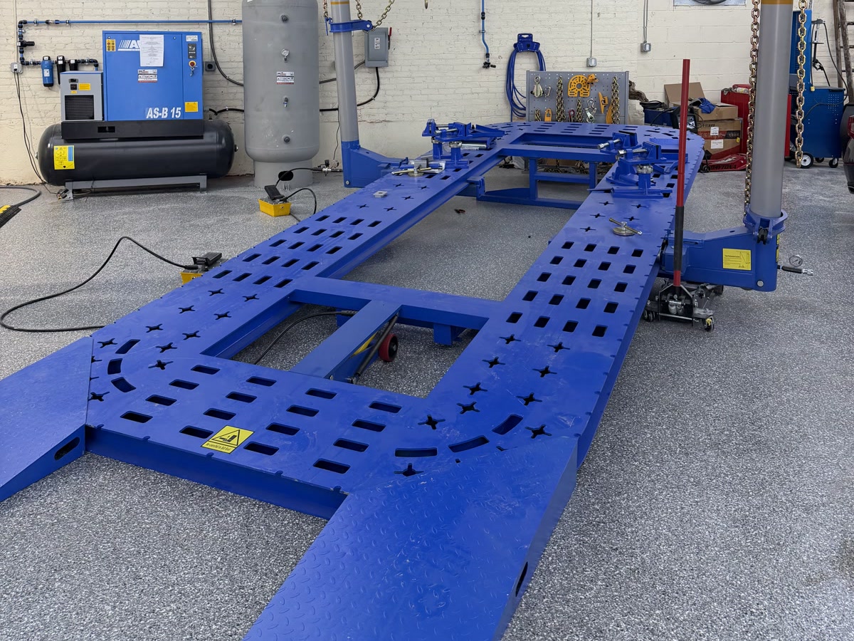 Frame straightening rack with pulling towers and chains in the Waxman Jersey City shop