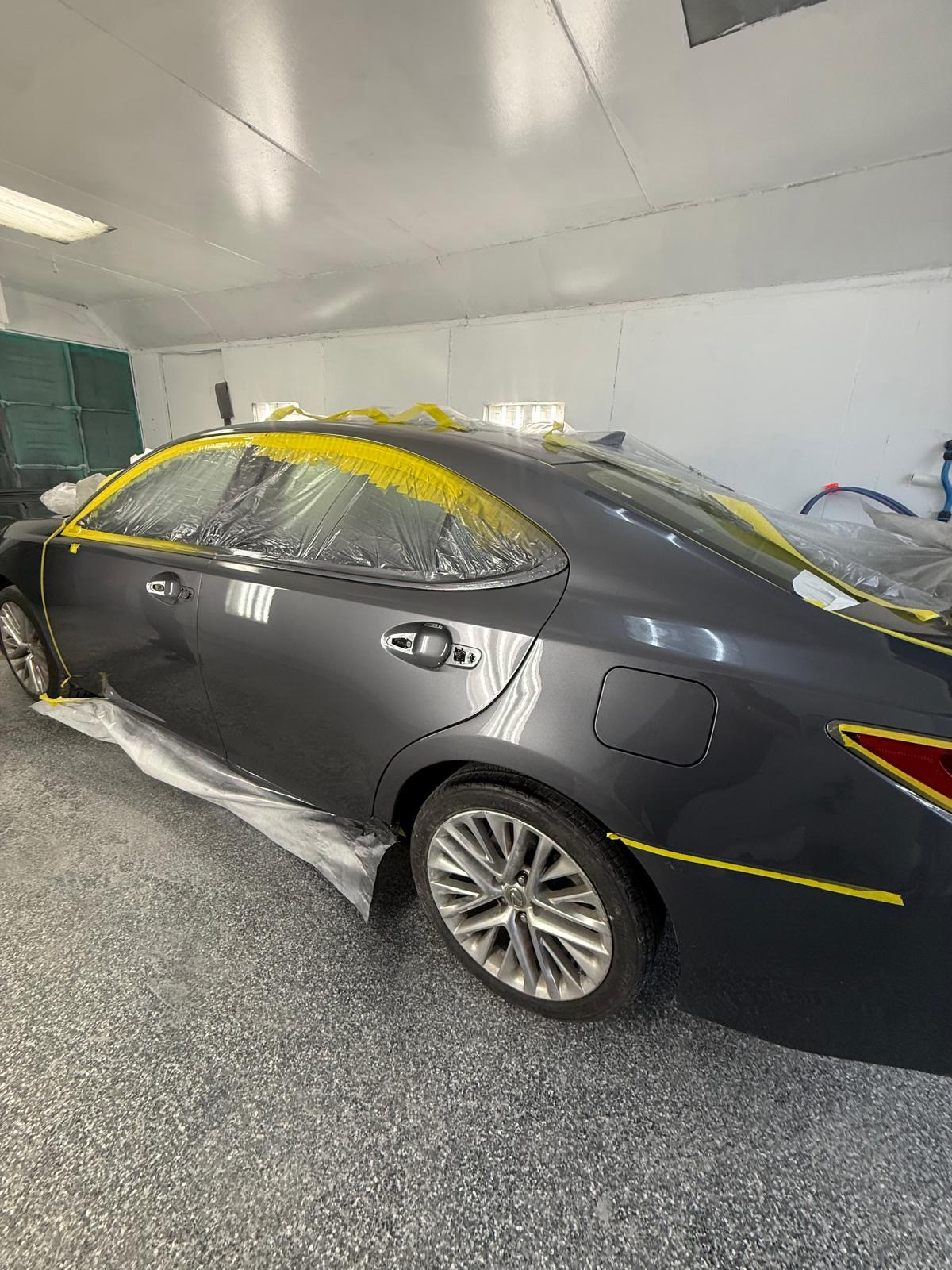 The same Lexus ES in the Waxman paint booth, rear quarter panel repaired and refinished