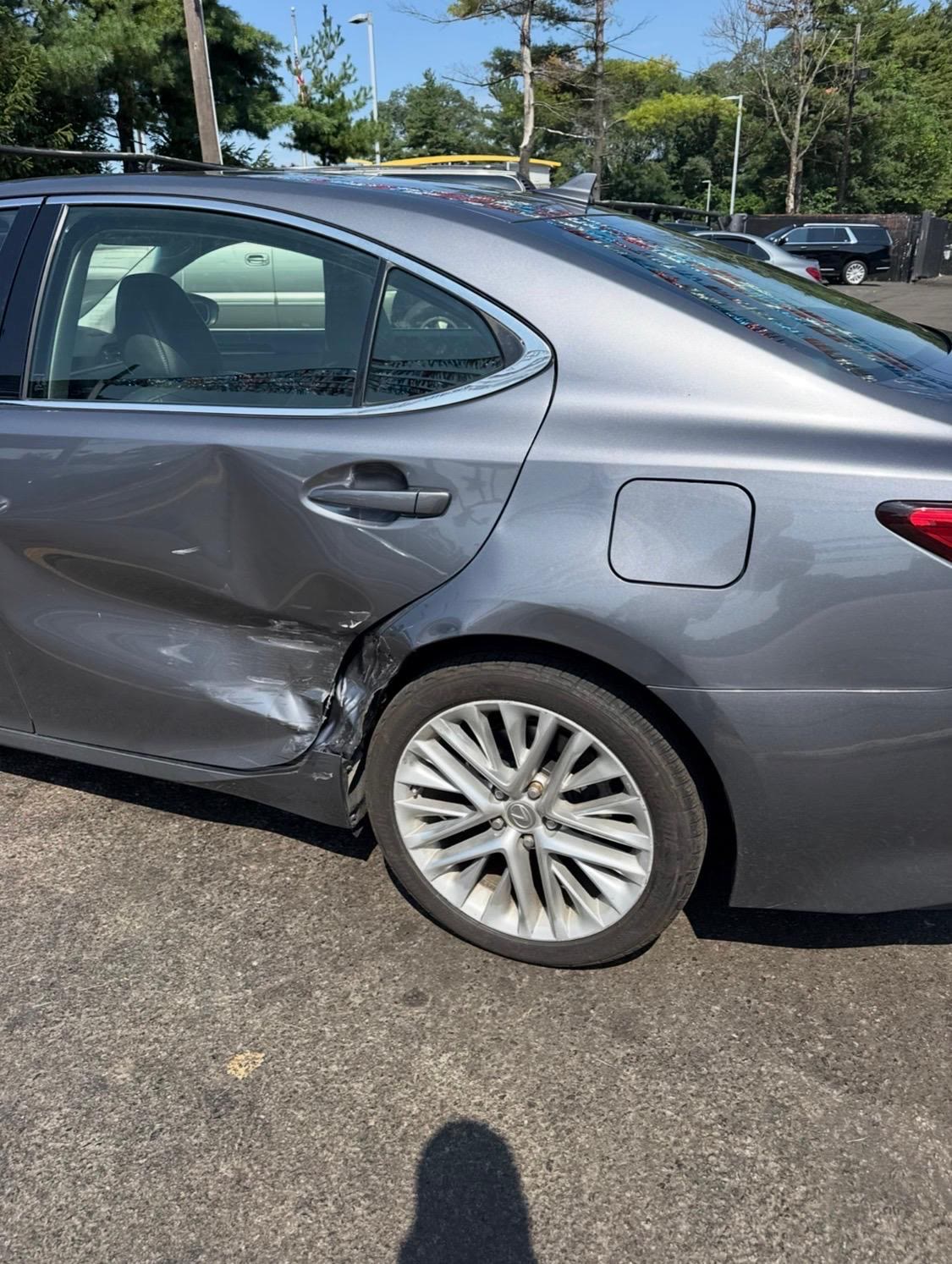 Lexus ES with a crushed rear door and quarter panel after a side impact, before repair at Waxman Collision
