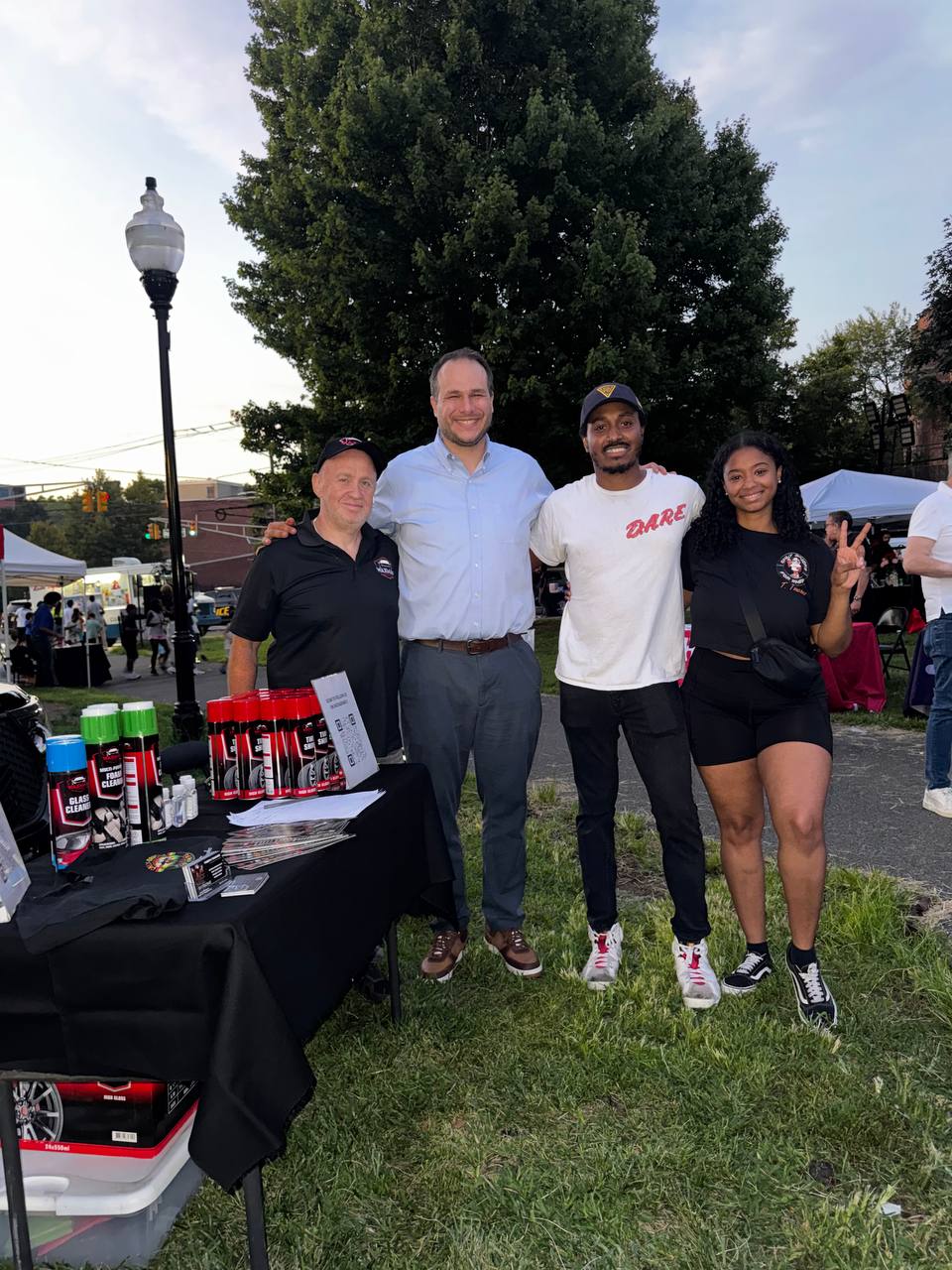 The Waxman team with Jersey City Mayor James Solomon at the shop's table during National Night Out