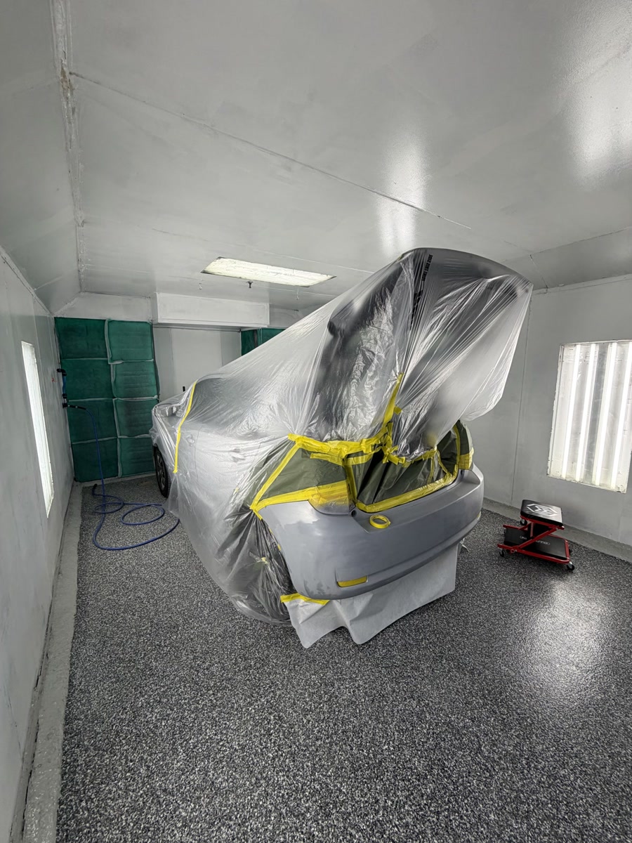 Vehicle masked and taped inside the Waxman paint booth in Jersey City